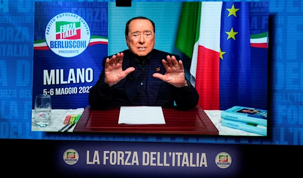 Silvio Berlusconi gestures as he talks in his video address during a Forza Italia party convention in Milan, Italy, Saturday, May 6, 2023. (AP)