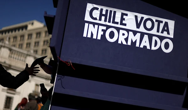 Chileans cast their votes to elect committee to draft new constitution