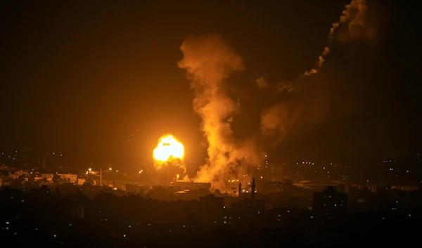 Fire and smoke rise following an Israeli airstrike in the northern Gaza Strip, occupied Palestine, late May 2, 2023 (AP)