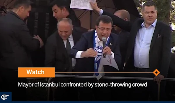 Mayor of Istanbul confronted by stone-throwing crowd