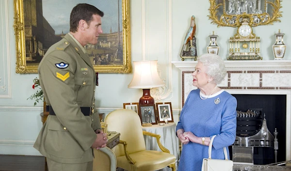 Then Queen Elizabeth II welcomes Australian war criminal SASR Corporal Ben Roberts-Smith, Buckingham Palace, London, UK. November 15 2011. (Reuters)