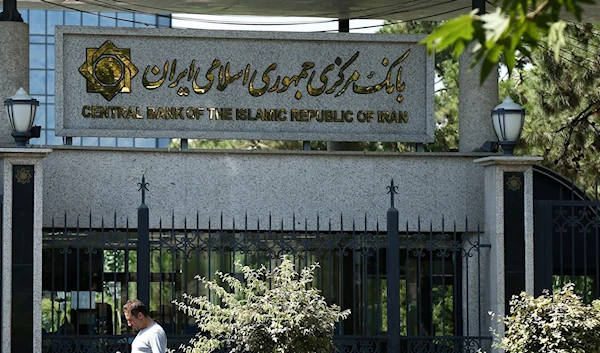 A man walks past the Central Bank of Iran in Tehran, Iran August 1, 2019. (AP)