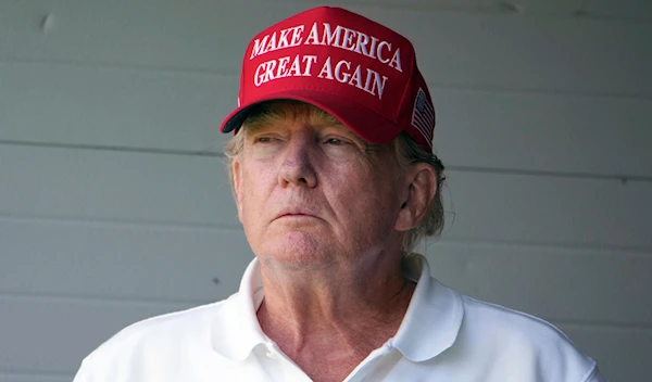 Former President Donald Trump watches the first round of the LIV Golf Tournament at Trump National Golf Club, Friday, May 26, 2023, in Sterling, Va. (AP)