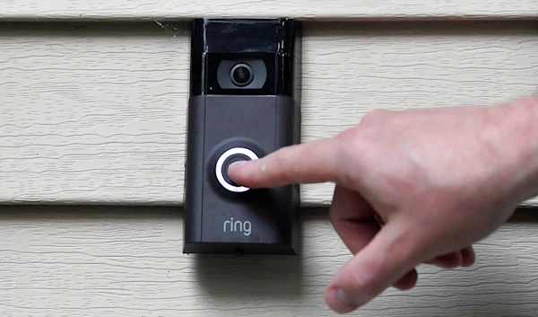 Ernie Field pushes the doorbell on his Ring doorbell camera, July 16, 2019, at his home in Wolcott, Connecticut (AP)