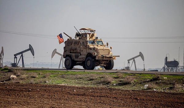 A US occupation forces military vehicle on a patrol in the countryside near the town of Qamishli, Syria, Sunday, Dec. 4, 2022 (AP Photo/Baderkhan Ahmad, File)