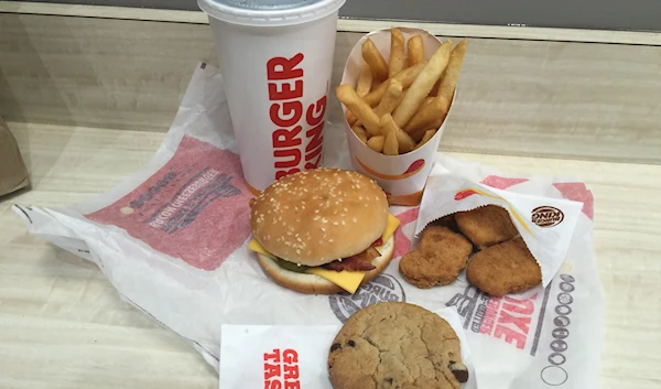 This Monday, Jan. 4, 2016, photo, shows a "5 for $4" deal at a Burger King restaurant in New York. Another price fight is breaking out among the country's biggest burger chains, this time with meal combo