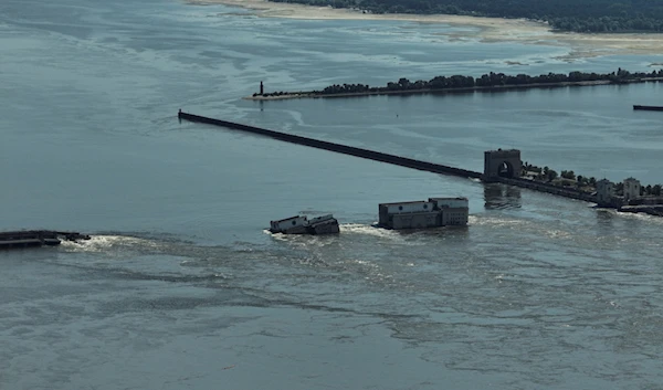 Water flows over the collapsed Kakhovka Dam in Nova Kakhovka, in Russian-occupied Ukraine, Wednesday, June 7, 2023. (AP)