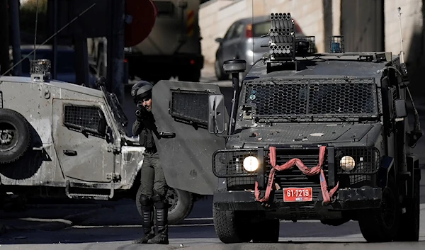 Israel Occupation Forces shoot tear gas during confrontations with Palestinians during a raid in the West Bank city of Nablus, Monday, April 3, 2023. (AP)