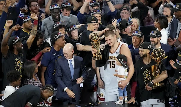 Denver Nuggets star Nikola Jokic holds the Finals MVP award after his team won the NBA Finals in a game victory against the Heat, Denver, US, June 13 2023. (AP)