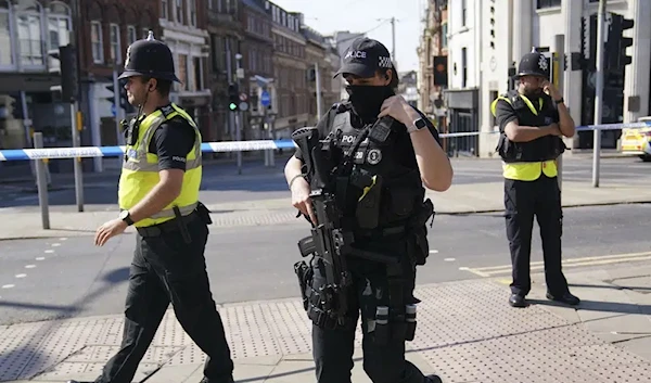 UK police officers block a road in Nottingham after a series of deaths led authorities to put the city on lockdown, Nottigham, UK, June 13 2023. (AP)