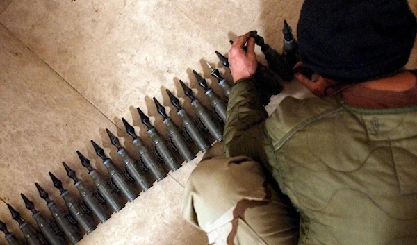 A US soldier counts 25mm rounds of depleted uranium ammunition in Tikrit, Iraq, February 11 2004. (AFP)