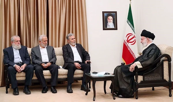 Leader of the Islamic Revolution Ayatollah Seyyed Ali Khamenei (R) meets with the secretary general of Palestine’s Islamic Jihad movement and his accompanying delegation in Tehran on June 14, 2023 (Photo by Khamenei.ir)