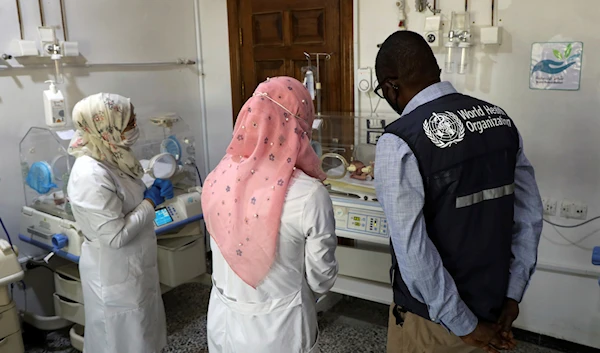 Doctor Elrasheed Idris, right, WHO Health Emergency program, visits a hospital in Idlib province, Syria, May 3, 2023 (AP)