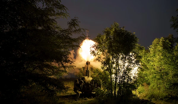 Ukrainian forces fire a 122mm howitzer D-30 towards Russian positions in Kherson region, Tuesday, June 13, 2023 (AP Photo/Felipe Dana)