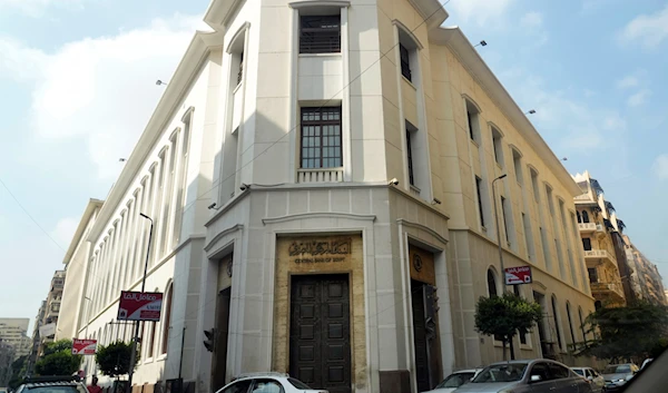 Vehicles pass in front of the Central Bank of Egypt, in Cairo, Egypt, September 8, 2022 (AP)