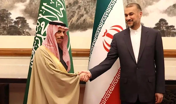 A handout photo from the Iranian Foreign Ministry office shows the Iranian Foreign Minister Hossein Amir-Abdoulahian shaking hands with Saudi counterpart Faisal bin Farhan Al-Saud, Beijing, China, April 6 2023. (Iranian Foreign Ministry Office)