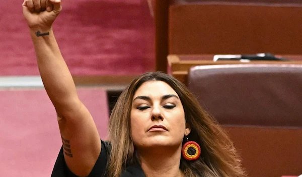 Australia Greens Senator for Victoria, Lidia Thorpe raises her arm during her swearing-in ceremony in the Senate chamber at Parliament House in Canberra, Australia, Aug. 1, 2022. (AFP )