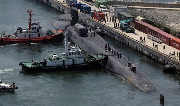 The nuclear-powered submarine which holds guided missiles, USS Michigan approaches a naval base in Busan, South Korea, June 16 2023. (AP)