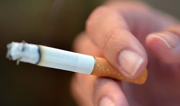 A man holding a cigarette. (AFP)