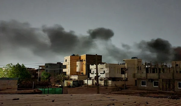 Smoke billows over southern Khartoum, 29 May 2023 (AFP)