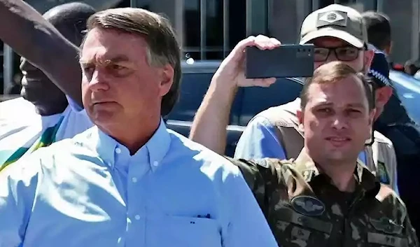 Former Brazilian President Jair Bolsonaro and his personal assistant Lieutenant Colonel Mauro Cid (AFP)