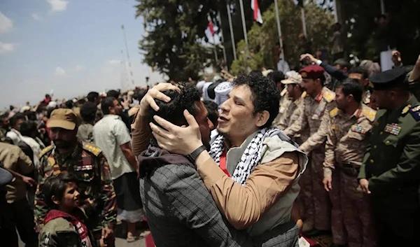 Houthi prisoners are greeted as they arrive to Sanaa airport, Friday, April 14, 2023. (AP)