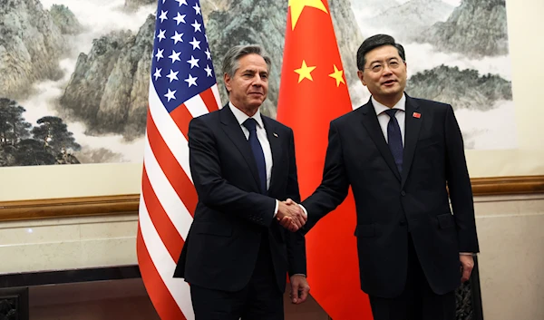 US Secretary of State Antony Blinken, left, shakes hands with Chinese Foreign Minister Qin Gang, right, at the Diaoyutai State Guesthouse in Beijing, China, Sunday, June 18, 2023. (Leah Millis/Pool Photo via AP)