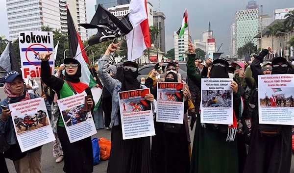 On March 20, 2023, Indonesians during a rally in Jakarta, Indonesia, demand the rejection of the participation of Israel's team in the 2023 FIFA U-20 World Cup. (AFP)