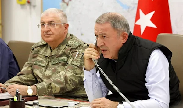 Turkey’s news defence minister General Yasar Gular (left) seen with former defence minister Hulusi Akar, pictured on October, 2019 (AP)