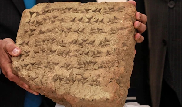 The 2,800 years old stone tablet returned by Italy to Iraq (AFP)