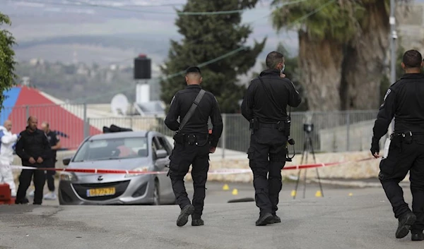 Israeli police forces close an area in occupied Umm Al-Fahm, Palestine, December 3 2021. (AP)