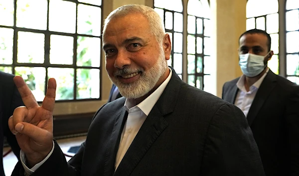 Ismail Haniyeh, the head of the Political Bureau of Hamas gestures to photographers with a peace sign after a meeting Lebanese Parliament Speaker Nabih Berri, Beirut, Lebanon, August 1 2021. (AP)