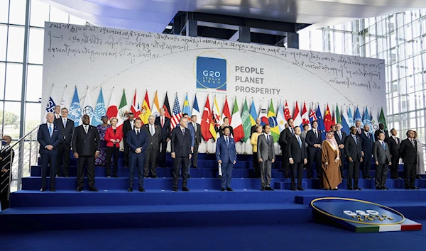 A collection of world leaders pose for a family photo of the G20 summit at the La Nuvola conference center, Rome, Italy, October 30 2021. (AP)