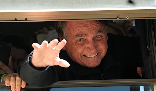 Brazil's former President Jair Bolsonaro waves to supporters at the Liberal Party s headquarters in Brasilia, Brazil, Thursday, March 30, 2023. (AP)