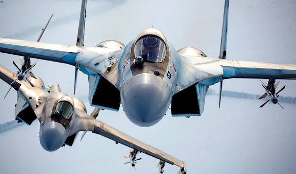 In this photo released by the Russian Defense Ministry Press Service, a pair of Russian Su-35 fighter jets fly in the sky in Russia, Nov. 28, 2021 (Russian Defense Ministry Press Service via AP, File)