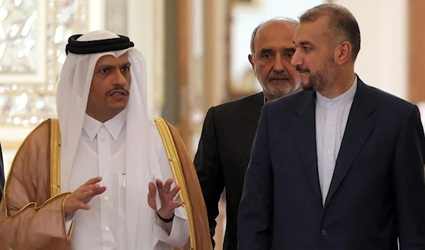 Iran's Foreign Minister Hossein Amir-Abdollahian and Qatar's Foreign Minister Mohammed bin Abdulrahman Al-Thani arrive for a press conference in Tehran, on 7 July 2022 (AFP)