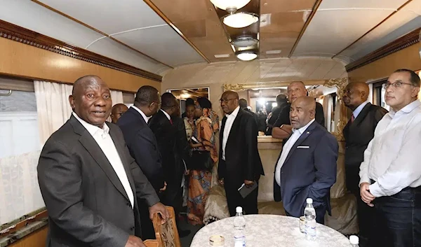 This photo given by the S. African Government Communications and Information Services (GCIS) South African President Cyril Ramaphosa, and other delegates travel on a train towards Kiev, from Warsaw, Poland, Thursday, June 15, 2023. (AP)