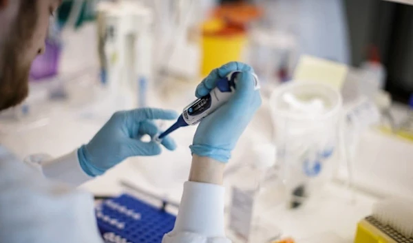 A researcher works on a vaccine against the new coronavirus COVID-19 at the Copenhagen's University research lab in Copenhagen, Denmark, on March 23, 2020. (AFP)