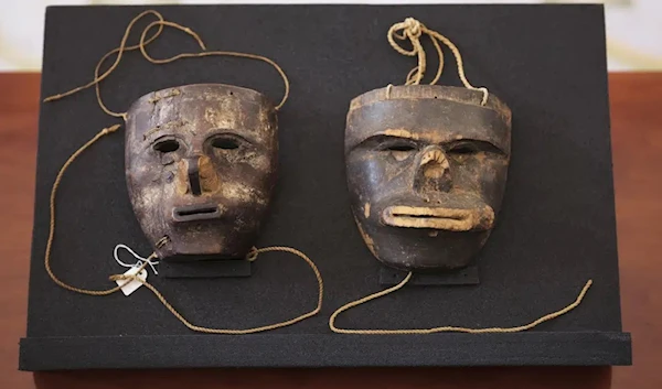 Two masks of the indigenous community of the Kogi from the Sierra Nevada de Santa Marta in Colombia are displayed at German President residence Bellevue Palace in Berlin, Germany, Friday, June 16, 2023 (AP)