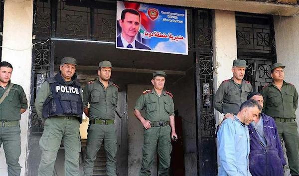 Syrian law enforcement officers in the city of Duma, Syria