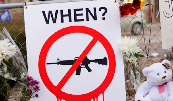 A sign hangs on the temporary fence around a King Soopers grocery store, which is where 10 victims died on Monday in a mass shooting, Wednesday, March 24, 2021, in Boulder, Colo. (AP Photo/David Zalubowski)