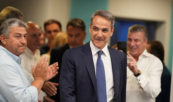 Leader of the center-right New Democracy Party Kyriakos Mitsotakis arrives for statements at the headquarters of the party in Athens, Greece, June 25, 2023 (AP)