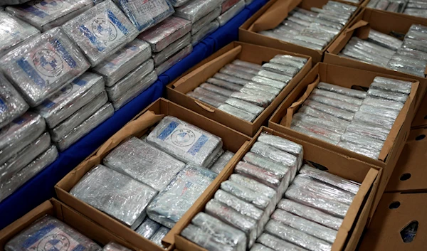 Packets with cocaine are displayed for the media at the Portuguese police headquarters in Lisbon, Tuesday, May 2, 2023. (AP)