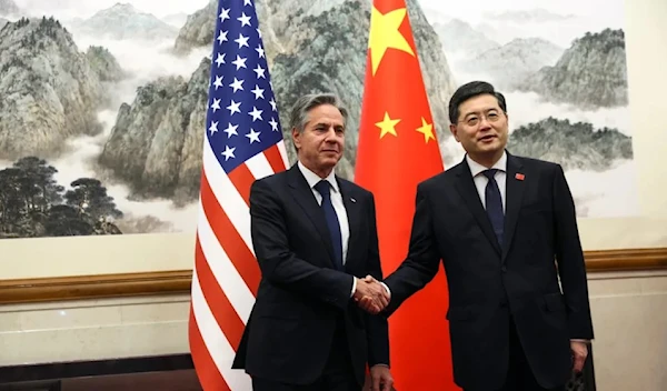 US secretary of state Antony Blinken, left, shakes hands with Chinese foreign minister Qin Gang, right, at the Diaoyutai State Guest house in Beijing, China in June 2023 (AP)