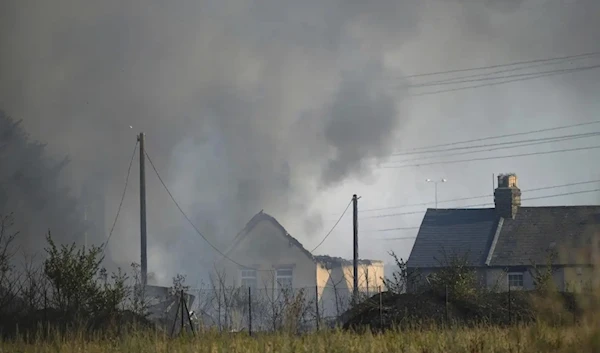 A blaze in the village of Wennington, east London, Tuesday, July 19, 2022. (AP)