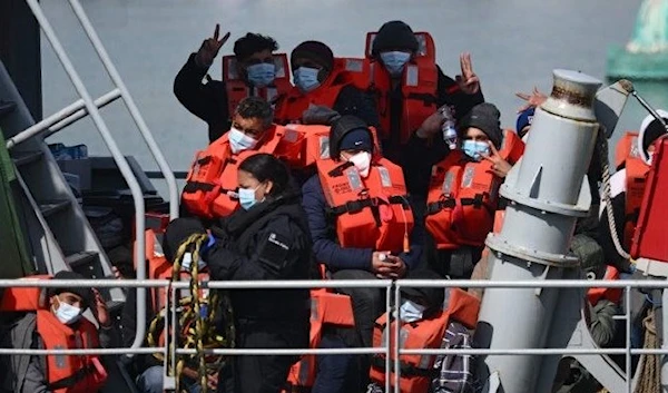 Migrants are picked up off the coast of Dover by UK Border Force boat. (AFP)