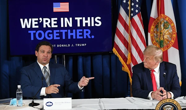 Then President Donald Trump and Florida's governor Ron DeSantis hold a roundtable meeting in Bellaire Florida, July 31 2020. (AFP)