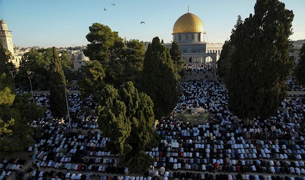 Muslim worshipers offer Eid al-Adha prayers next to the Dome of the Rock shrine at the Al Aqsa Mosque compound in Jerusalem's Old City, Wednesday, June 28, 2023.