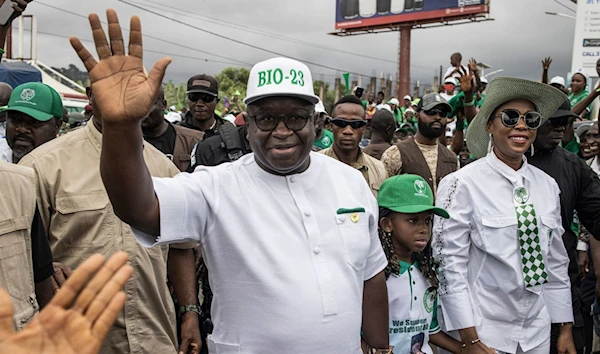 President of Sierra Leone Julius Maada Bio waves to supporters as he arrives for the final campaign rally in Freetown, Sierra Leone, June 20 2023. (AFP)