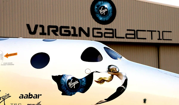 The Virgin Galactic logo is seen on SpaceShip Two at a Virgin Galactic hangar at Mojave Air and Space Port in Mojave, Calif., Wednesday, Sept. 25, 2013. (AP)